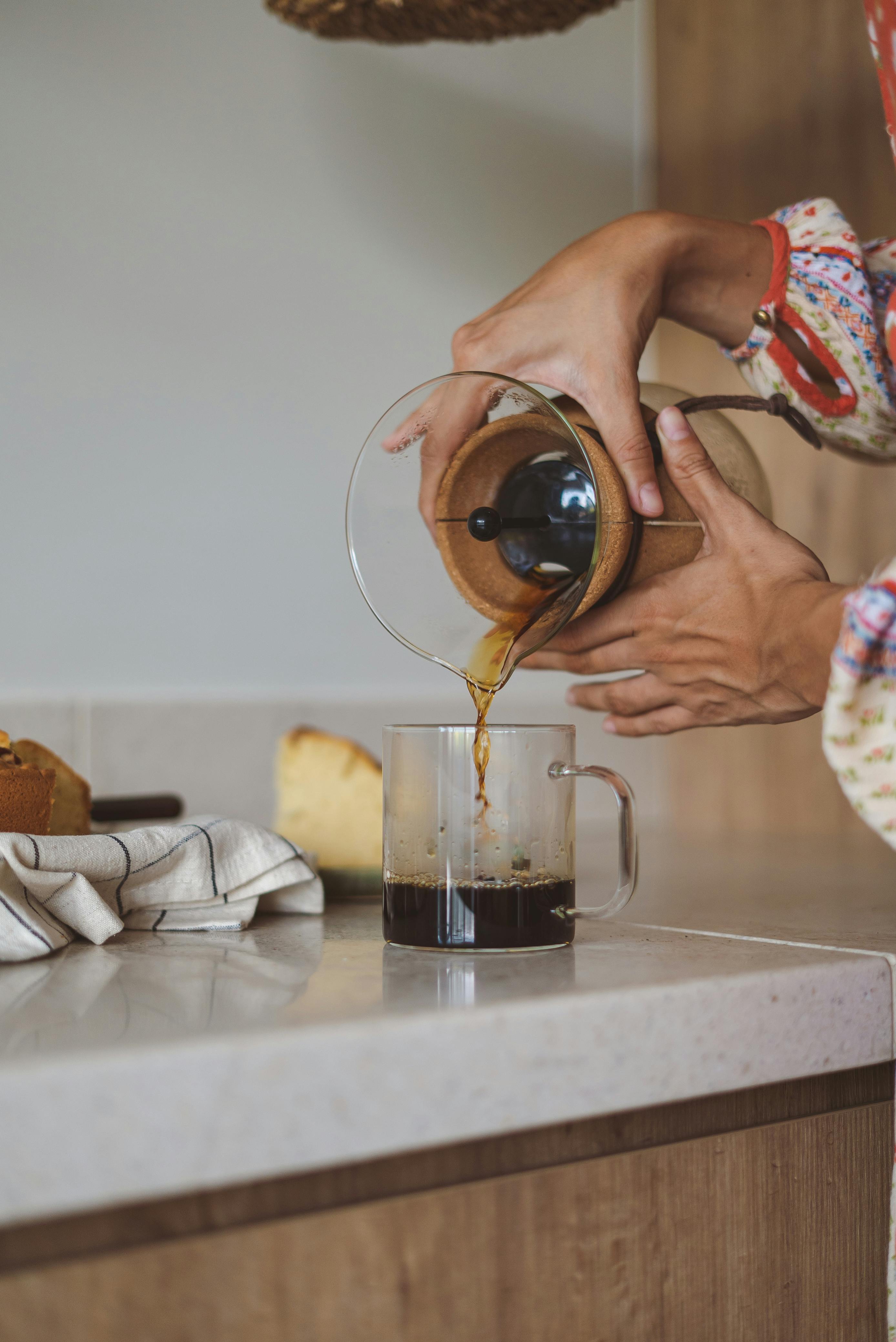 Pouring specialty coffee from a Chemex brewer 