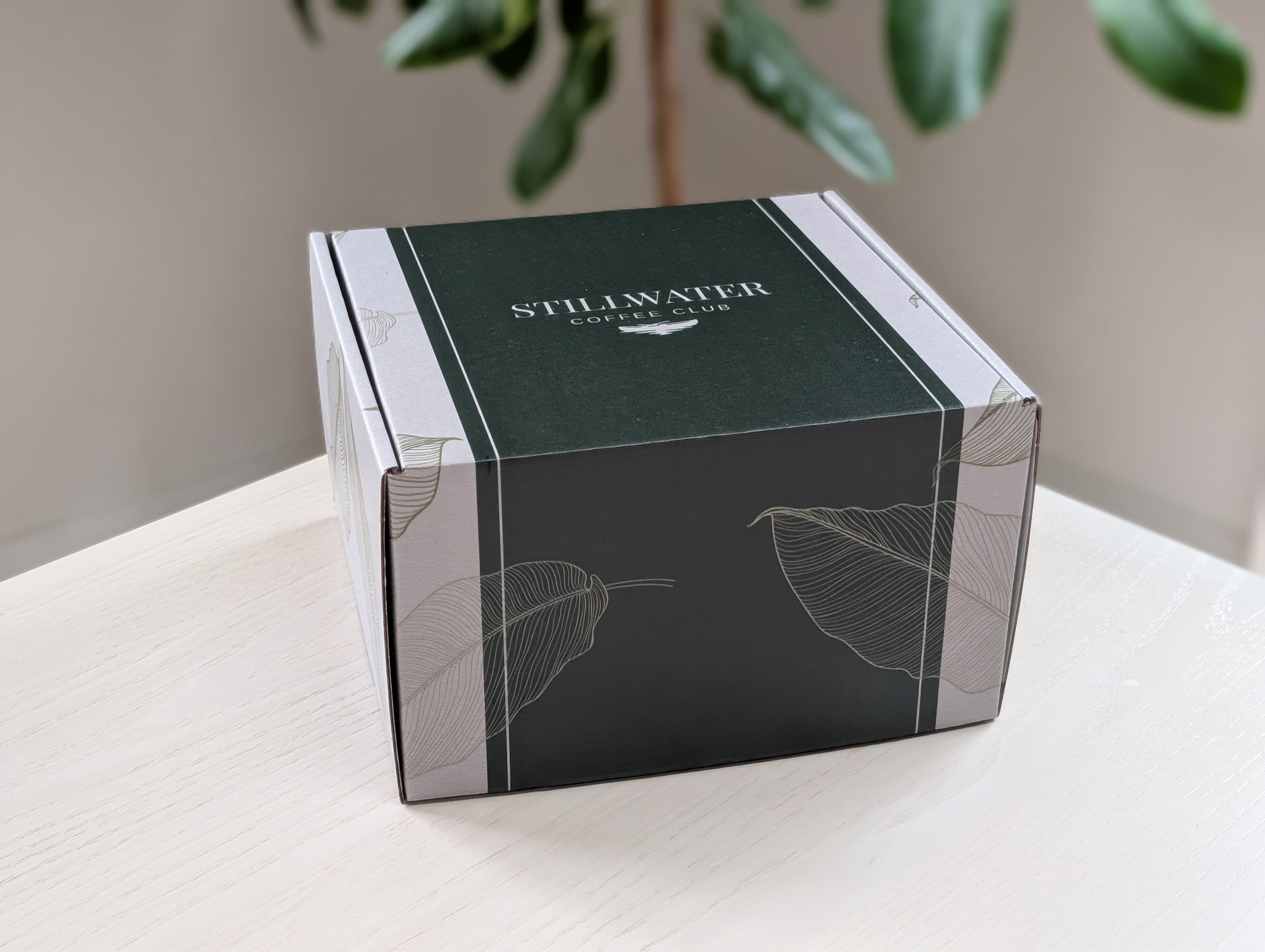 Stillwater Coffee Club gift box laying on a table in a kitchen