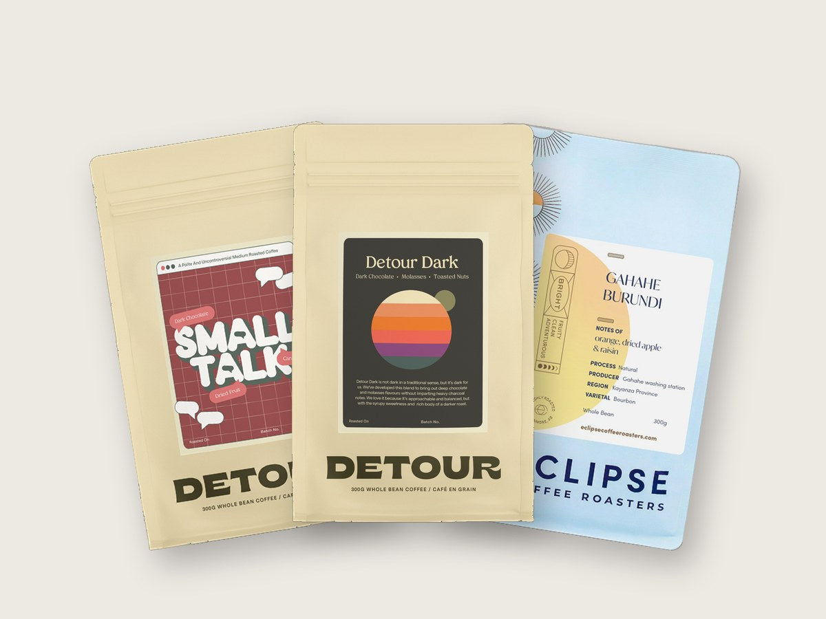 Three bags of coffee from Detour and Eclipse, two Canadian roasters